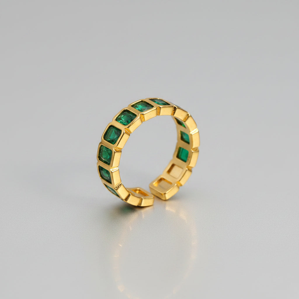 Anillo abierto con piedras color esmeralda