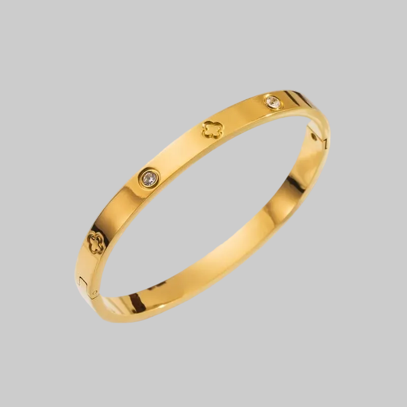 Pulsera dorada con circones y trébol