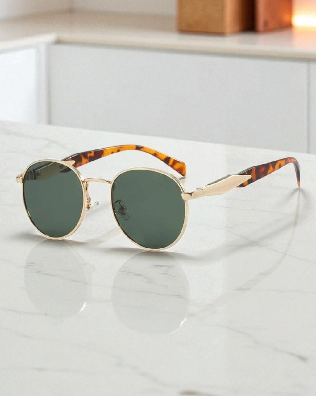 Lentes de sol redondo marco dorado