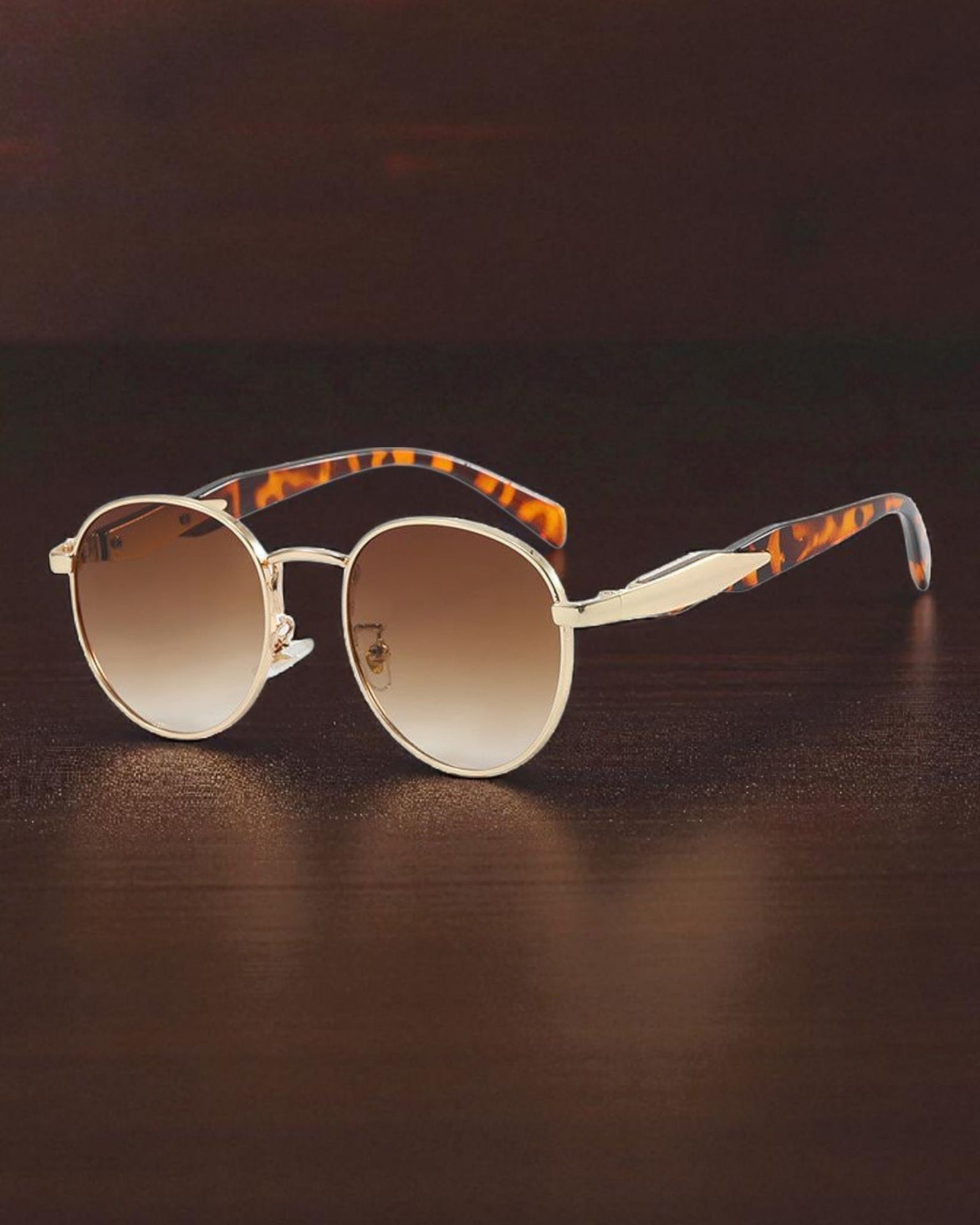 Lentes de sol redondo marco dorado